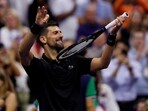 Novak Djokovic celebrates winning his third-round match against Britain's Cameron Norrie