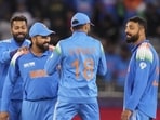 Varun Chakaravarthy celebrates the wicket of New Zealand's Mitchell Santner during the ICC Champions Trophy. (PTI)