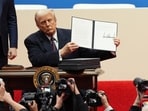FILE - President Donald Trump holds up an executive order after signing it at an indoor Presidential Inauguration parade event in Washington, Jan. 20, 2025. (AP Photo/Matt Rourke, File) FILE - President Donald Trump holds up an executive order after signing it at an indoor Presidential Inauguration parade event in Washington, Jan. 20, 2025. (AP Photo/Matt Rourke, File)