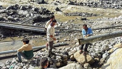 A water pipeline being repaired after a landslide and heavy rains in Manali in Himachal Pradesh on Friday. (PTI Photo) A water pipeline being repaired after a landslide and heavy rains in Manali in Himachal Pradesh on Friday. (PTI Photo)