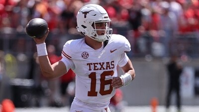Texas Longhorns quarterback Arch Manning (16) drops back to pass against the Ohio State Buckeyes (IMAGN IMAGES via Reuters Connect)