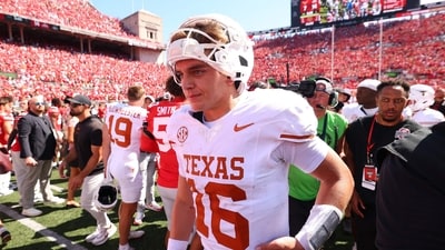 Arch Manning #16 of the Texas Longhorns leaves the field after a 14-7 loss to the Ohio State Buckeyes (Getty Images via AFP) Arch Manning #16 of the Texas Longhorns leaves the field after a 14-7 loss to the Ohio State Buckeyes (Getty Images via AFP)