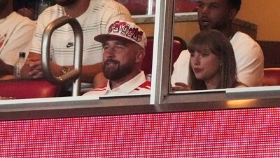 Taylor Swift, front right, sits with fiance Travis Kelce. (AP) Taylor Swift, front right, sits with fiance Travis Kelce. (AP)