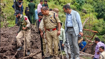 Police personnel and others during a search and rescue operation after a cloudburst following heavy rainfall, at Ramgarh, in Ramban district, Jammu and Kashmir, on Saturday. (PTI) Police personnel and others during a search and rescue operation after a cloudburst following heavy rainfall, at Ramgarh, in Ramban district, Jammu and Kashmir, on Saturday. (PTI)