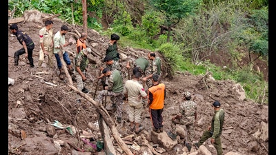 Police personnel and others during a search and rescue operation after a cloudburst following heavy rainfall, at Ramgarh, in Ramban district, Jammu and Kashmir, on Saturday. (PTI) Police personnel and others during a search and rescue operation after a cloudburst following heavy rainfall, at Ramgarh, in Ramban district, Jammu and Kashmir, on Saturday. (PTI)