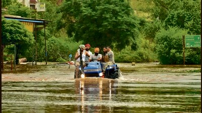 Residents moving to safer locations from a flooded area near Ajnala in Amritsar on Saturday. (Sameer Sehgal/HT) Residents moving to safer locations from a flooded area near Ajnala in Amritsar on Saturday. (Sameer Sehgal/HT)