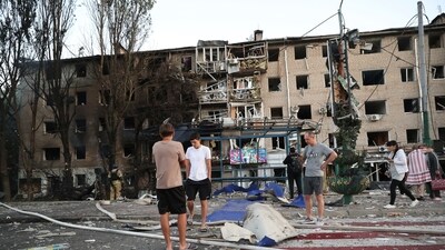 Local residents stand near their destroyed home following Russian air strike in Zaporizhzhia, Ukraine, (AP) Local residents stand near their destroyed home following Russian air strike in Zaporizhzhia, Ukraine, (AP)