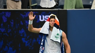 Ben Shelton reacts emotionally after being forced to leave the court and withdraw from the US Open. (AFP) Ben Shelton reacts emotionally after being forced to leave the court and withdraw from the US Open. (AFP)