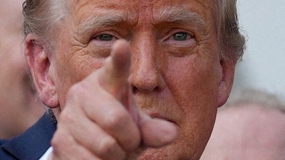Trump hints at rebate checks for American households, funded by tariff revenues, leading to legislative proposals. REUTERS/Leah Millis/File Photo (REUTERS)