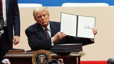 FILE - President Donald Trump holds up an executive order after signing it at an indoor Presidential Inauguration parade event in Washington, Jan. 20, 2025. (AP Photo/Matt Rourke, File) (AP) FILE - President Donald Trump holds up an executive order after signing it at an indoor Presidential Inauguration parade event in Washington, Jan. 20, 2025. (AP Photo/Matt Rourke, File) (AP)