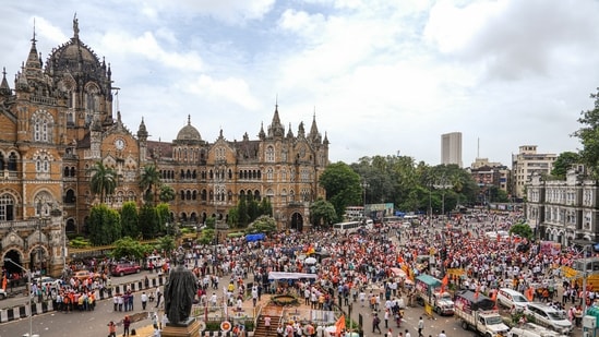 Supporters of activist Manoj Jarange Patil, who is on indefinite hunger strike demanding Maratha reservation, gather outside Chhatrapati Shivaji Maharaj Terminus to join his agitation in Mumbai, on Saturday, 30 August 2025. (PTI)