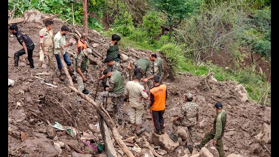 Police personnel and others during a search and rescue operation after a cloudburst following heavy rainfall, at Ramgarh, in Ramban district, Jammu and Kashmir, on Saturday. (PTI)