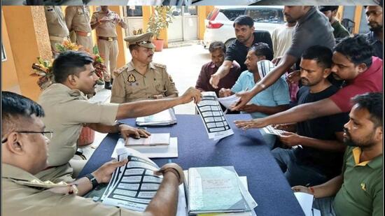 Police personnel during an awareness campaign against digital arrest, in Lucknow on Saturday. (HT)