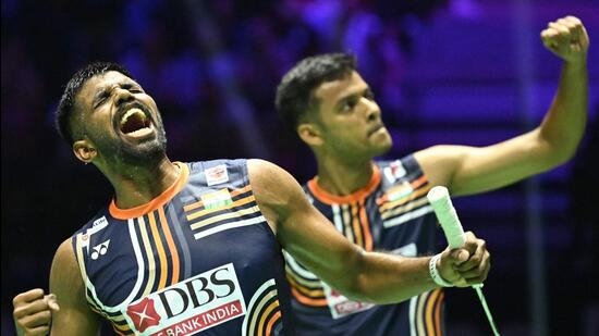 Satwiksairaj Rankireddy and Chirag Shetty celebrate after beating Malaysia's Aaron Chia and Wooi Yik Soh. (AFP)