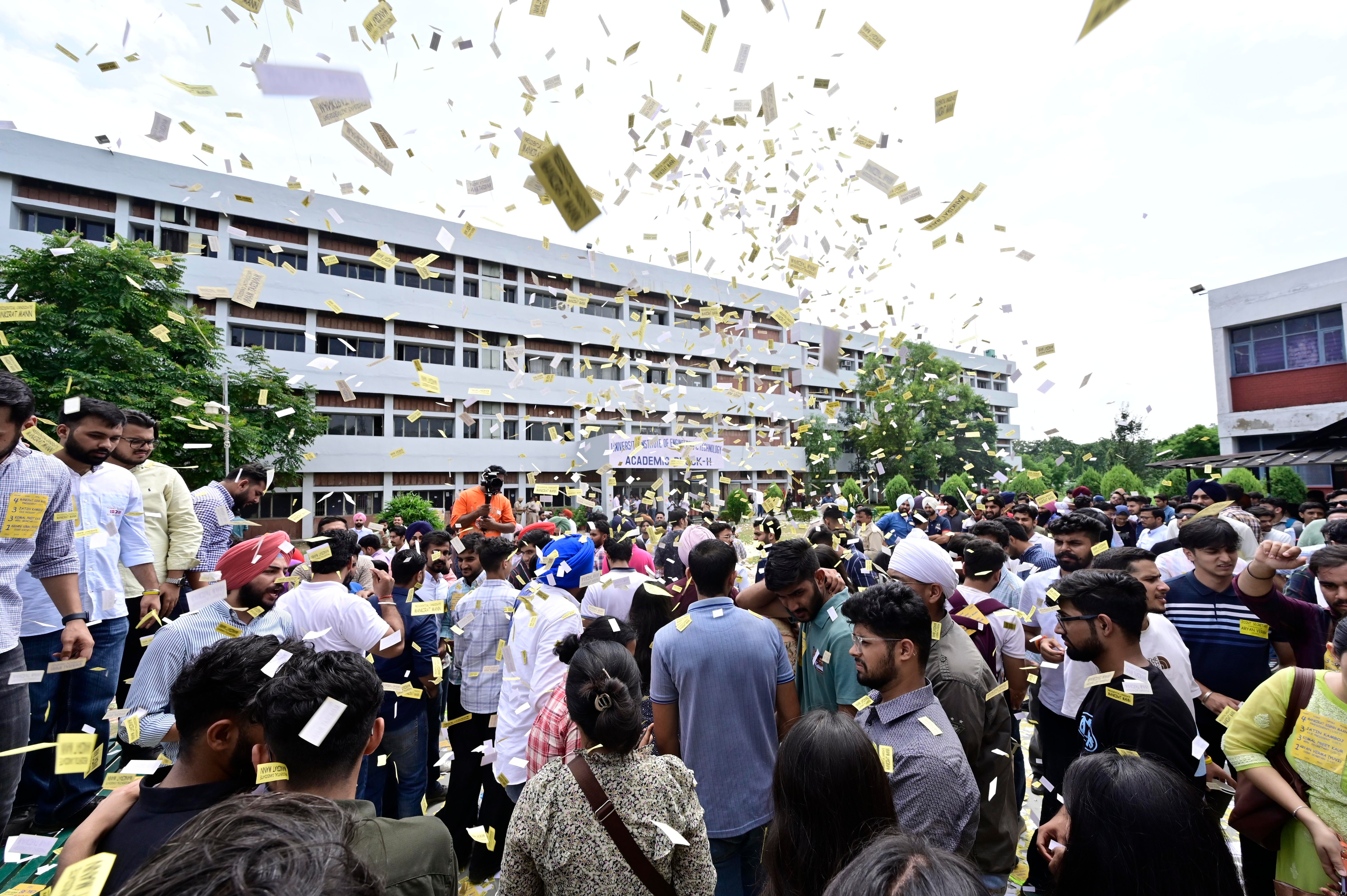 ASAP supporters flinging the stickers in air during their campaign at UIET, Panjab University, on Saturday. (Ravi Kumar/HT) ASAP supporters flinging the stickers in air during their campaign at UIET, Panjab University, on Saturday. (Ravi Kumar/HT)