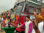 Aam Aadmi Party (AAP) state chief and cabinet minister Aman Arora on Saturday flagged off 11 trucks of relief material from the Sunam grain market to flood-affected areas of the state. Aam Aadmi Party (AAP) state chief and cabinet minister Aman Arora on Saturday flagged off 11 trucks of relief material from the Sunam grain market to flood-affected areas of the state.