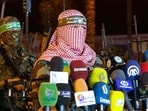 File picture of Abu Obeida (R), spokesman for the armed wing of Hamas, the Ezzedine al-Qassam Brigades.