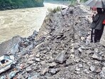 An ambulance veered off the Kiratpur-Manali highway after heavy rain in Mandi on Sunday. (PTI) An ambulance veered off the Kiratpur-Manali highway after heavy rain in Mandi on Sunday. (PTI)