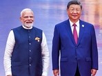 Prime Minister Narendra Modi (L) and China's President Xi Jinping pose during the welcoming ceremony of the Shanghai Cooperation Organization (SCO) summit in Tianjin on August 31.