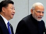 China's President Xi Jinping and India's Prime Minister Narendra Modi at Shanghai Cooperation Organisation Summit in Qingdao, Shandong Province, China on June 10, 2018. 