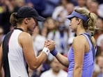 Iga Swiatek, of Poland, left, greets Anna Kalinskaya, of Russia, after winning their match during the third round of the US Open. Iga Swiatek, of Poland, left, greets Anna Kalinskaya, of Russia, after winning their match during the third round of the US Open.