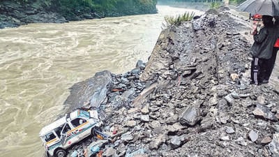 An ambulance veered off the Kiratpur-Manali highway after heavy rain in Mandi on Sunday. (PTI) An ambulance veered off the Kiratpur-Manali highway after heavy rain in Mandi on Sunday. (PTI)