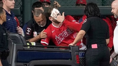 Los Angeles Angels left fielder Taylor Ward is treated for injury against the Houston Astros in Houston. (AP) Los Angeles Angels left fielder Taylor Ward is treated for injury against the Houston Astros in Houston. (AP)