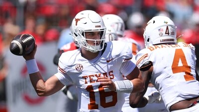 Arch Manning #16 of the Texas Longhorns throws a first half pass. (Getty Images via AFP)
