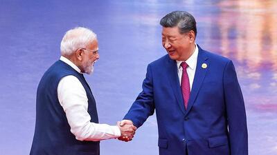 India’s Prime Minister Narendra Modi (L) and China’s President Xi Jinping shake hands during the welcoming ceremony of the Shanghai Cooperation Organization (SCO) summit in Tianjin. (AFP/PIB Photo) India’s Prime Minister Narendra Modi (L) and China’s President Xi Jinping shake hands during the welcoming ceremony of the Shanghai Cooperation Organization (SCO) summit in Tianjin. (AFP/PIB Photo)
