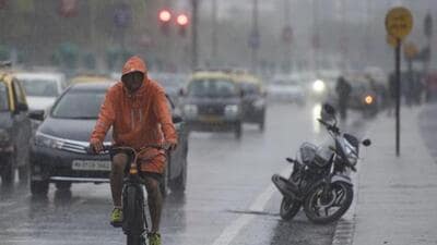 Mumbai, India - July 31, 2019: A man drives bicycle in heavy rain at Marinedrive in Mumbai, India, on Wednesday, July 31, 2019. (Photo by Pratik Chorge/Hindustan Times) (Pratik Chorge/HT Photo) Mumbai, India - July 31, 2019: A man drives bicycle in heavy rain at Marinedrive in Mumbai, India, on Wednesday, July 31, 2019. (Photo by Pratik Chorge/Hindustan Times) (Pratik Chorge/HT Photo)
