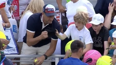 Polish CEO Piotr Szczerek was caught swiping an autographed hat from a child at the US Open. Polish CEO Piotr Szczerek was caught swiping an autographed hat from a child at the US Open.