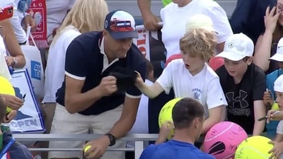 Polish CEO Piotr Szczerek was caught swiping an autographed hat from a child at the US Open. (@Arrucha/X)