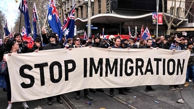Protesters hold a banner during a "March for Australia" anti-immigration rally in Melbourne on August 31, 2025. (AFP) Protesters hold a banner during a "March for Australia" anti-immigration rally in Melbourne on August 31, 2025. (AFP)