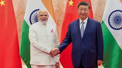 PM Narendra Modi and Chinese President Xi Jinping shake hand before their meeting on the sidelines of the SCO summit in Tianjin, China on Sunday (PMO via AP) PM Narendra Modi and Chinese President Xi Jinping shake hand before their meeting on the sidelines of the SCO summit in Tianjin, China on Sunday (PMO via AP)