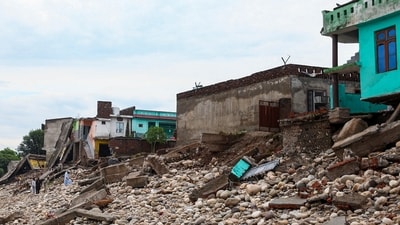 Houses lay damaged at a flood ravaged area on the banks of the Tawi river after heavy rainfall, in Jammu district (PTI) Houses lay damaged at a flood ravaged area on the banks of the Tawi river after heavy rainfall, in Jammu district (PTI)