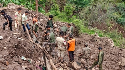 Police personnel and others during a search and rescue operation after a cloudburst following heavy rainfall, at Ramgarh, in Ramban district, Jammu and Kashmir, on Saturday. (PTI) Police personnel and others during a search and rescue operation after a cloudburst following heavy rainfall, at Ramgarh, in Ramban district, Jammu and Kashmir, on Saturday. (PTI)