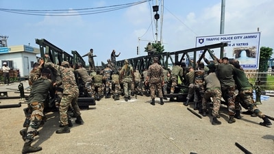 Indian soldiers constructing the Fourth Bridge of Jammu, which was damaged due to heavy rains and flash floods, in Jammu (ANI) Indian soldiers constructing the Fourth Bridge of Jammu, which was damaged due to heavy rains and flash floods, in Jammu (ANI)