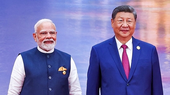 Prime Minister Narendra Modi (L) and China's President Xi Jinping pose during the welcoming ceremony of the Shanghai Cooperation Organization (SCO) summit in Tianjin on August 31. (AFP)