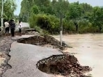 A road caved in Hoshiarpur's Nangal Khilarian village due to heavy rain on Monday. (Harpreet Kaur/HT Photo) A road caved in Hoshiarpur's Nangal Khilarian village due to heavy rain on Monday. (Harpreet Kaur/HT Photo)