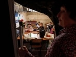 School students listen to their teacher during a lesson, in the basement of a municipal building during the first day in school in Bobryk, Sumy region, Ukraine, Monday, Sept. 1, 2025. 