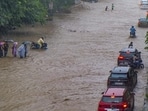 Commuters on a waterlogged road in Gurugram on Monday. (PTI)