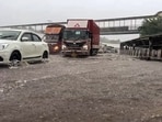 Commuters wade through waterlogged road due to heavy rain, in Gurugram on Monday, 1 September. Commuters wade through waterlogged road due to heavy rain, in Gurugram on Monday, 1 September.