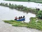 Indian Army personnel rescue local residents using a boat to evacuate through the flooded waters of the Ravi river at Lodhi Gujjar village in Ajnala, near Amritsar on Monday. (Sameer Sehgal/Hindustan Times) Indian Army personnel rescue local residents using a boat to evacuate through the flooded waters of the Ravi river at Lodhi Gujjar village in Ajnala, near Amritsar on Monday. (Sameer Sehgal/Hindustan Times)