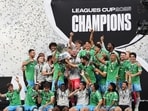 The Seattle Sounders lift the trophy after beating Inter Miami in a Leagues Cup final. The Seattle Sounders lift the trophy after beating Inter Miami in a Leagues Cup final.