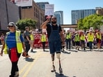 People participate in a Labor Day protest in Chicago, Illinois, U.S., September 1, 2025. Protesters march through the streets in anticipation of DHS agents coming to Chicago to enforce immigration raids. 