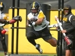 Pittsburgh Steelers running back Jaylen Warren, center, participates in the football team's OTA workout in Pittsburgh, Thursday, June 5, 2025. (AP Photo/Gene J. Puskar)