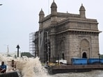 Waves crash over the promenade in front of Gateway of India in Mumbai. (ANI Photo) Waves crash over the promenade in front of Gateway of India in Mumbai. (ANI Photo)