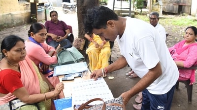 Booth Level Officer (BLO) verification documents of voters during the ongoing special intensive revision of electoral rolls in Patna, Bihar, India, Sunday, (Santosh Kumar/ Hindustan Times)