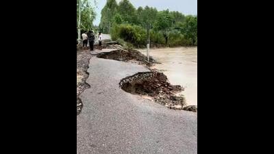 A road caved in Hoshiarpur's Nangal Khilarian village due to heavy rain on Monday. (Harpreet Kaur/HT Photo) A road caved in Hoshiarpur's Nangal Khilarian village due to heavy rain on Monday. (Harpreet Kaur/HT Photo)