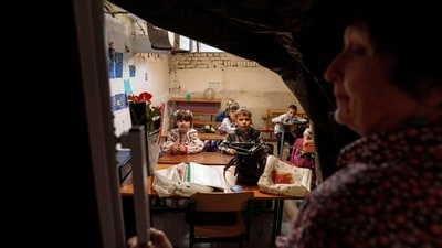School students listen to their teacher during a lesson, in the basement of a municipal building during the first day in school in Bobryk, Sumy region, Ukraine, Monday, Sept. 1, 2025. (AP) School students listen to their teacher during a lesson, in the basement of a municipal building during the first day in school in Bobryk, Sumy region, Ukraine, Monday, Sept. 1, 2025. (AP)